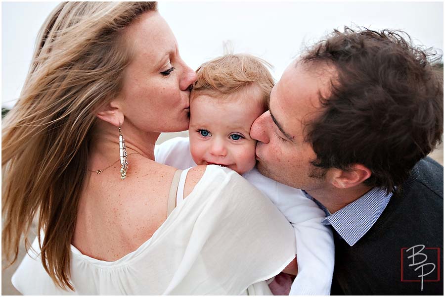 Family at San Francisco kissing baby girl