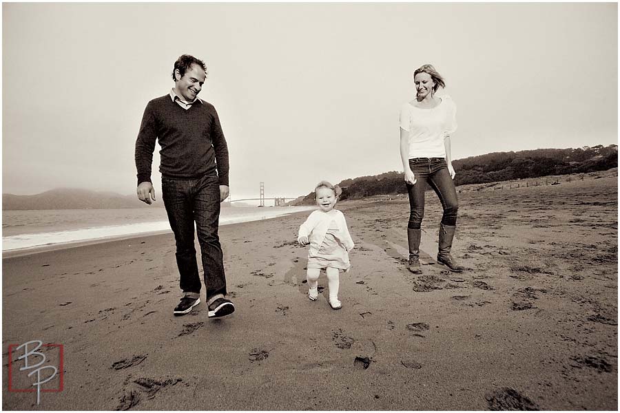 Family walking on the beach at San Francisco 