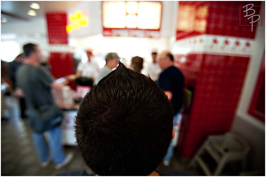 Guy at In N Out Counter Menu 