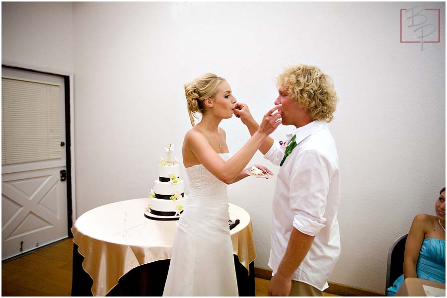 The bride and groom eating cake