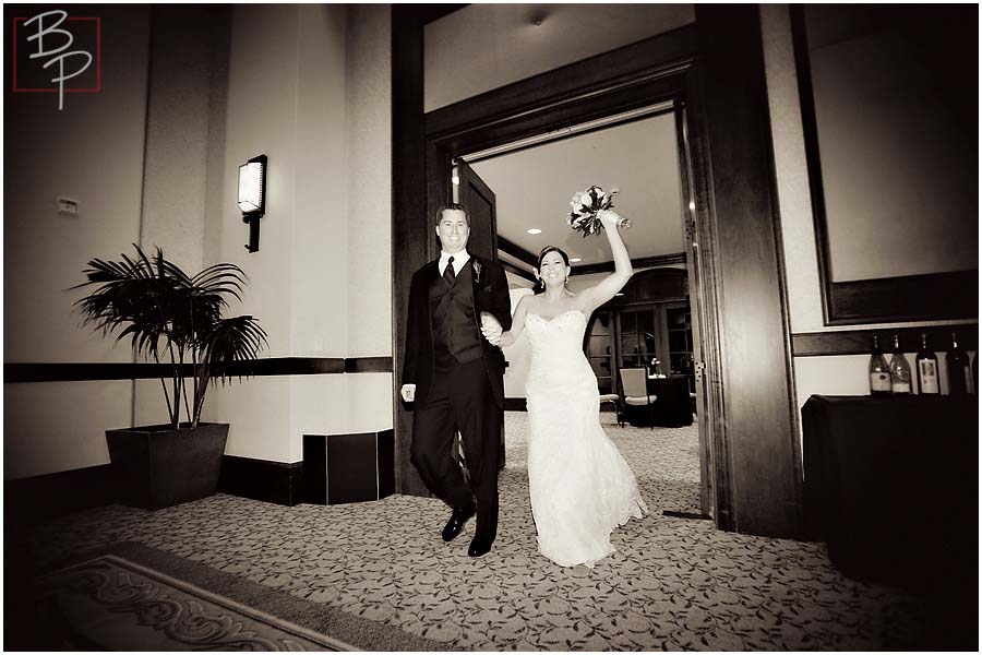 The bride and groom enter the reception