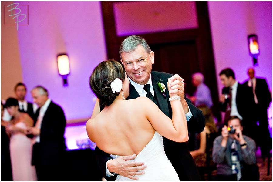 The bride and her father dance