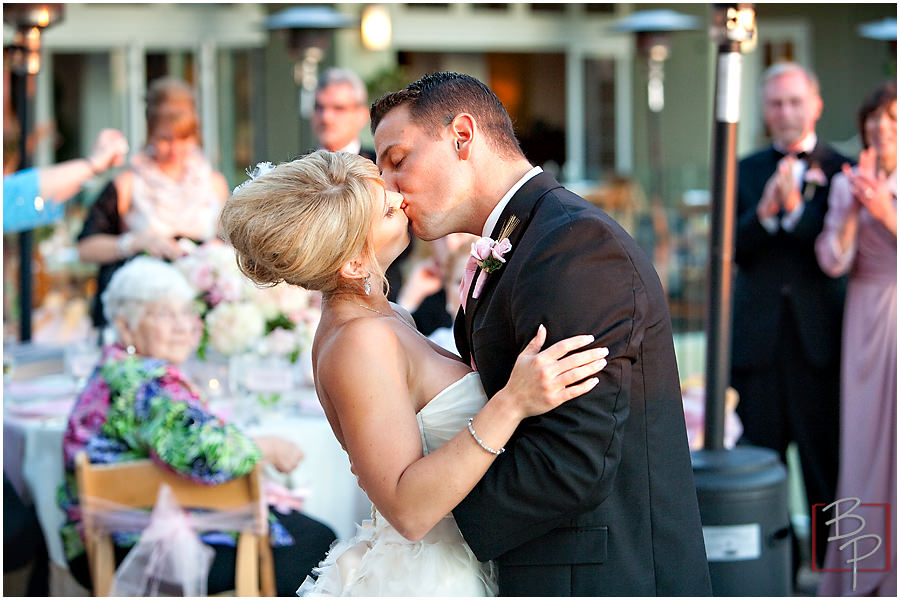 Bride and groom kiss photography