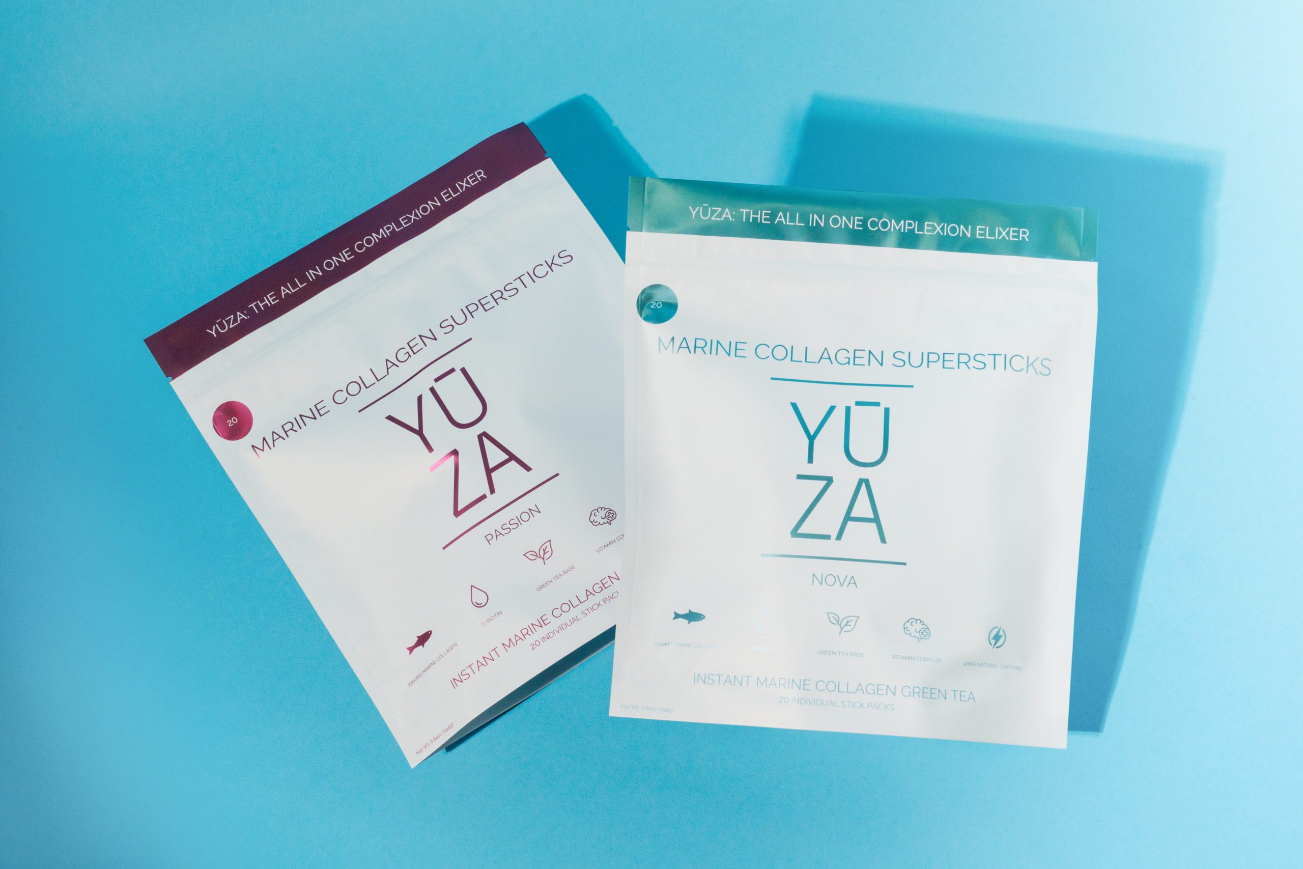 Two packets of yoza displayed on a vibrant blue background