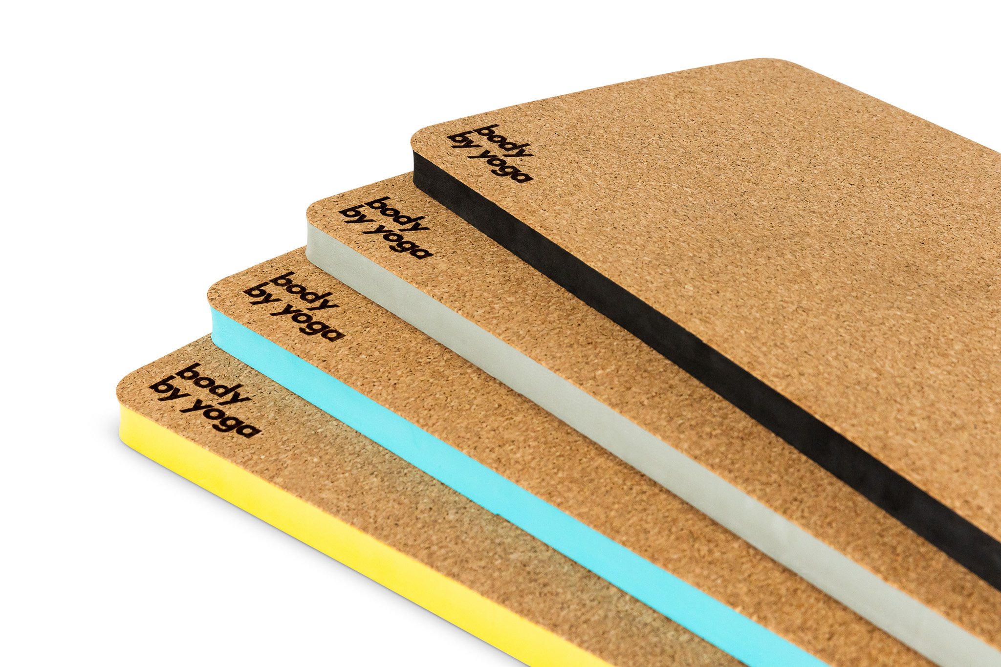 A stack of cork notepads in various colors