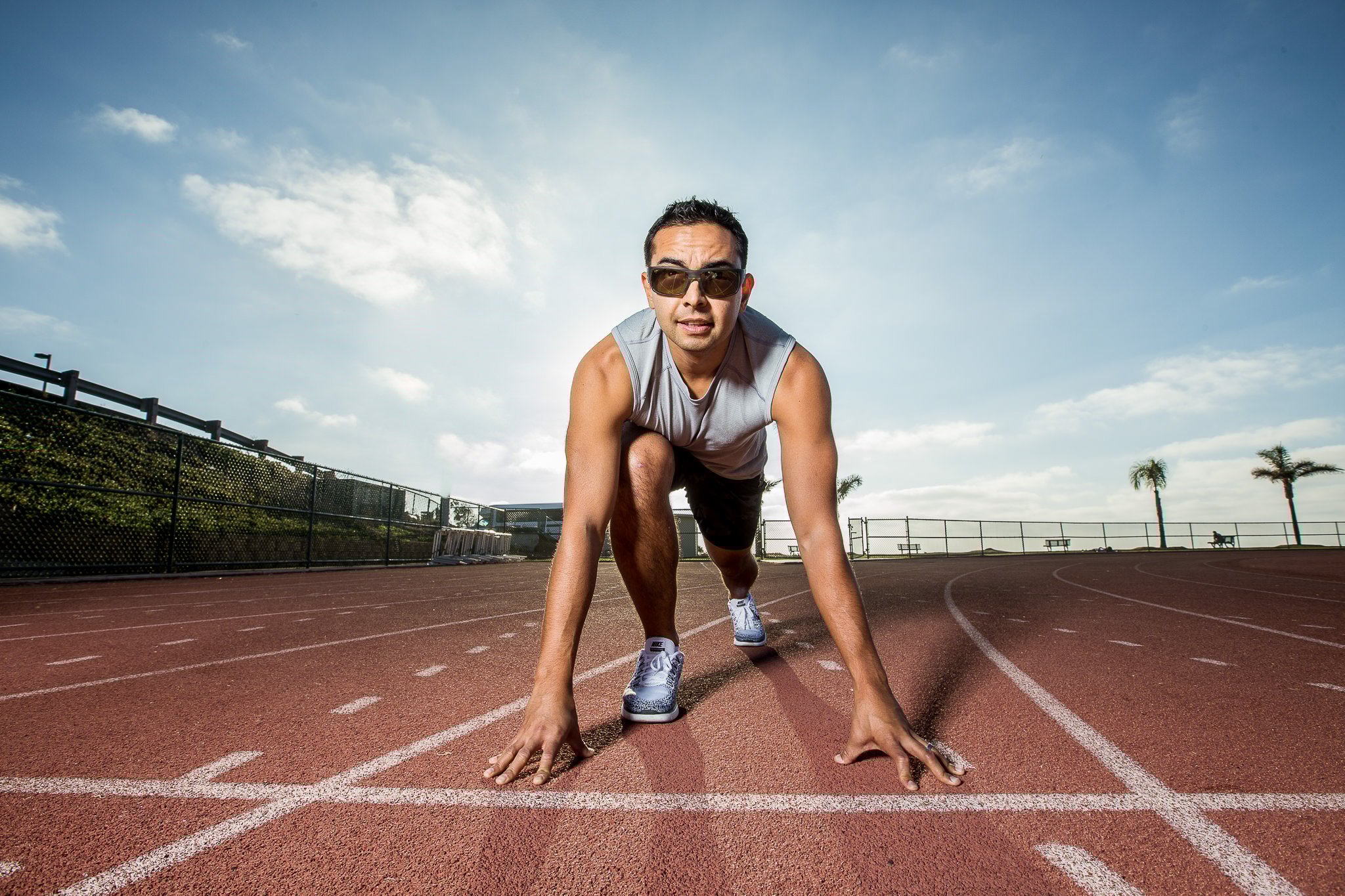 Runner in starting position on an outdoor track