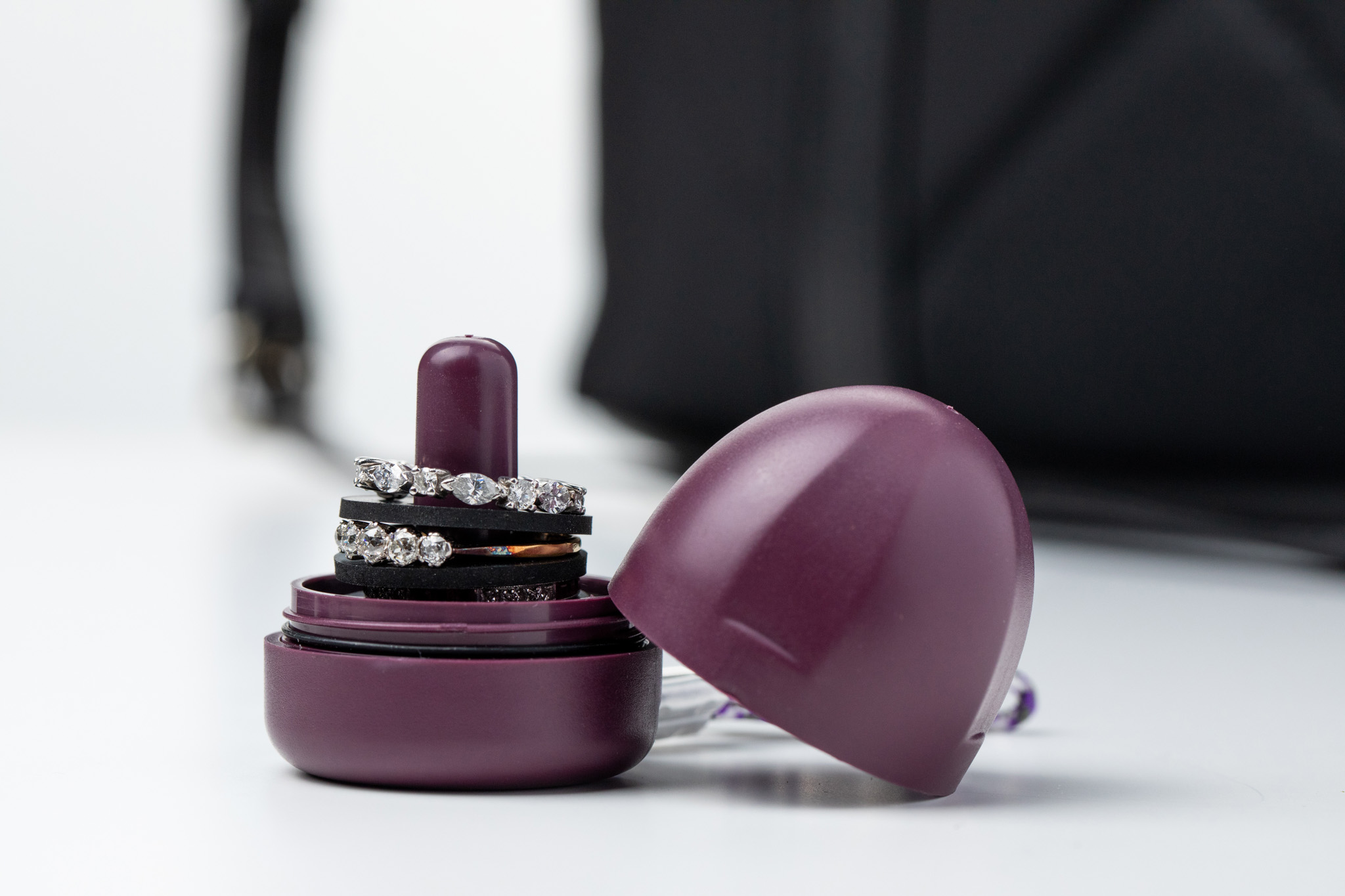 Diamond rings displayed on a purple ring holder
