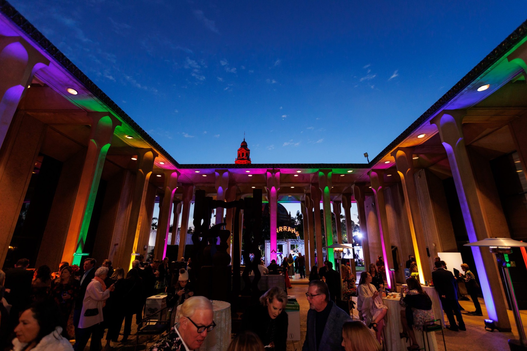 Outdoor event venue illuminated with colorful lights